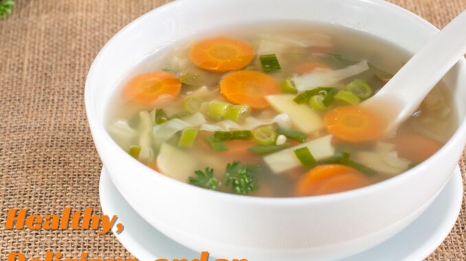 Homemade vegetable soup with a variety of fresh vegetables in a warm broth