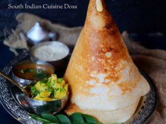 Delicious crispy dosa served with coconut chutney and sambar
